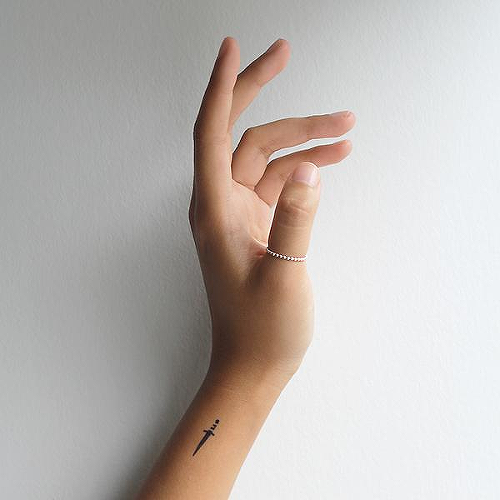 Obelus by Kurtis Conner is a Traditional temporary tattoo from inkbox - 0