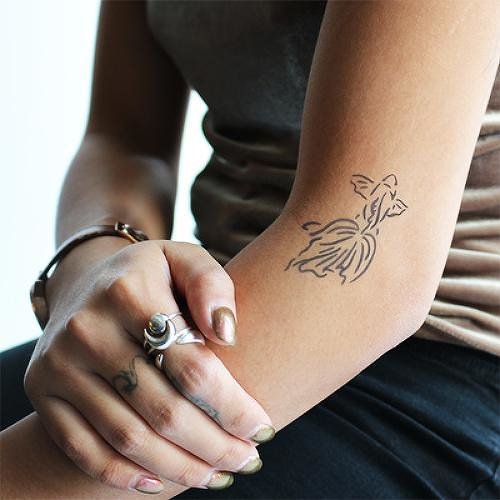 Plakat by Kristine Vodon is a temporary tattoo from inkbox - 2