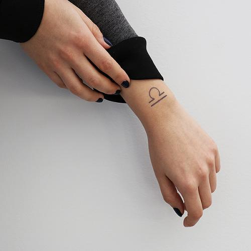 The Scales by Nikki Di Biasio is a Astrology temporary tattoo from inkbox - 0