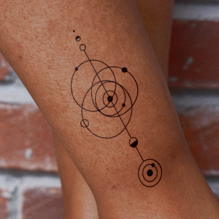 Planetary Revolution by Carsten Daub is a Geometric temporary tattoo from inkbox - compliment