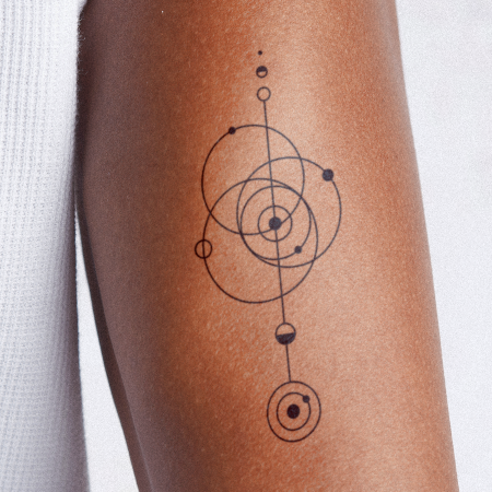 Planetary Revolution by Carsten Daub is a Geometric temporary tattoo from inkbox - main